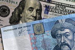 На украинских банкнотах предложили писать скопированную с долларов фразу